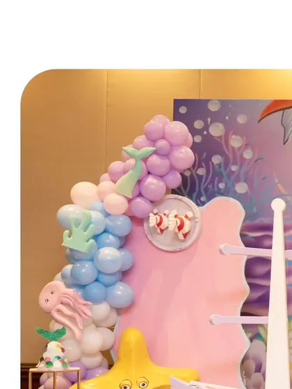 A close-up of the balloon decor from Kiara's mermaid party. We used shades of purple and blue, with a mermaid tail accent, to create the look of ocean bubbles.