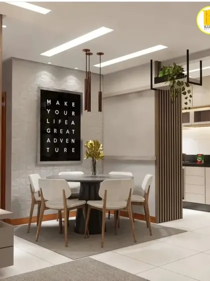 A wider view of the dining space, showing the motivational wall art and pendant lights that add personality to the room.