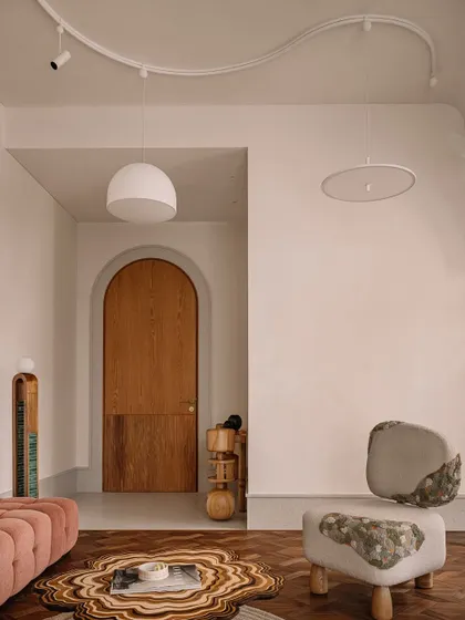 This daughter's bedroom is a chic and divine creation, a masterful curation of colors, materials, and artful furniture that feels both playful and sophisticated.