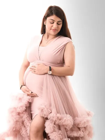 A variety of poses in a beautiful ruffled pink gown, showing its versatility for creating soft, romantic, and glamorous solo maternity portraits.