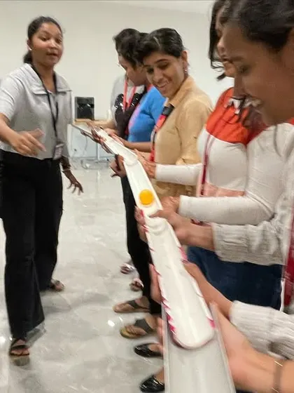 A close-up of the 'Pipeline' game, showing the focus and teamwork required.