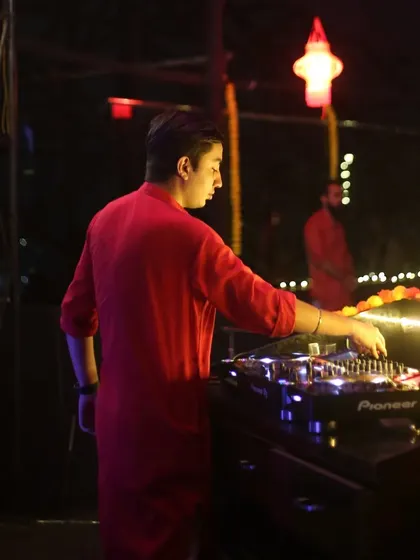 Another angle from the Diwali event, showing my focus on the mixer as I line up the next track.