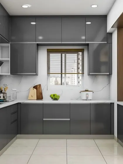 This U-shaped kitchen in a glossy dark grey finish makes a sophisticated statement. The layout provides extensive counter and cabinet space on three walls, creating a highly functional and enclosed cooking zone perfect for busy home chefs.