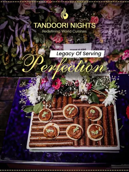 An artistic presentation of savory tarts on a unique wooden log platter, surrounded by flowers, demonstrating our legacy of serving perfection.