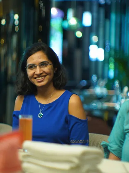A candid shot of a participant smiling during the workshop. The relaxed and friendly atmosphere is a key part of every experience I curate.