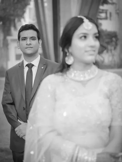 An artistic black and white shot with a shallow depth of field, creating a moody and romantic feel.