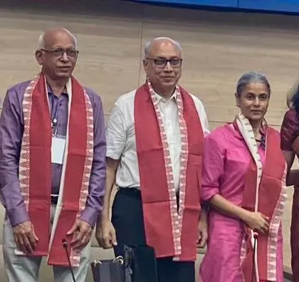 Standing with fellow activists and thinkers at a public event. Building a united front with like-minded individuals is essential to amplify our collective voice for social and economic justice.