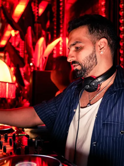A profile shot of me in deep concentration at the decks. Reading the crowd and selecting the next song is a crucial part of the craft.