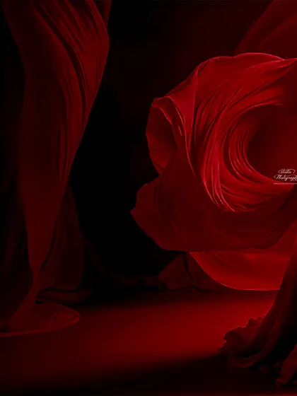 The power and beauty of motherhood captured in a single frame. We use dramatic lighting and flowing red fabric to create this breathtaking, high-fashion look in the studio.