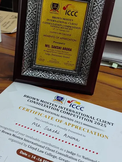 The certificate and memento of appreciation from the competition. These acknowledgements motivate me to continue contributing to legal education and mentorship.