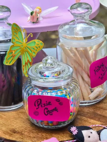 The little details make a theme come to life. Jars of "Pixie Gems" and "Fairy Wands" add a touch of magic to the candy buffet at this whimsical birthday party.