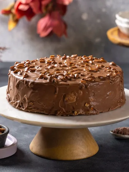 An almond-crusted chocolate cake for Ferns N Petals Luxe. The composition is simple and lets the cake's texture be the hero.