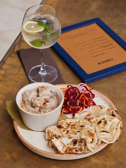 Our smoked chicken curry, creamy and flavourful, served with a delicate rumali roti. A light yet satisfying main course.