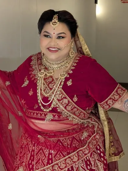 Creating a full bridal look for Shreyoshi on her first wedding anniversary. She wanted to relive her special day, and we went all out with a classic red lehenga and bold makeup.