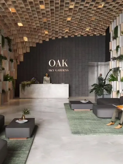 The lobby of the Oak tower at Sky Gardens, where natural materials like wood and stone are combined with integrated planters to create a welcoming, biophilic entrance experience.