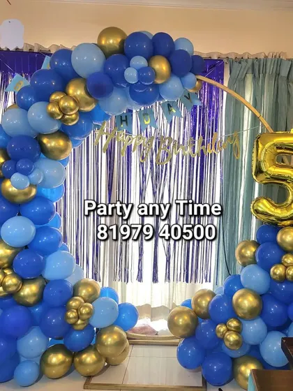 Another shot of the 5th birthday blue and gold balloon arch.