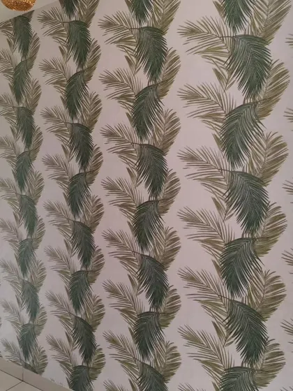 A simple palm leaf wallpaper in a neutral color palette. This design adds a subtle tropical touch without being overwhelming.