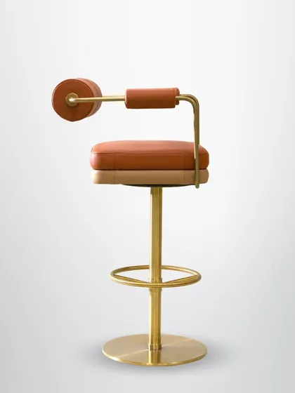 A closer look at our swanky barstools. The combination of tan leather, a brass-finished base, and a unique wrap-around backrest makes this a stylish and comfortable seating option for any home bar.
