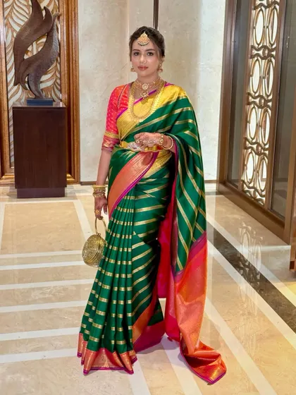 A full-length shot of Deeksha, capturing the grandeur of her Muhurtham attire. The makeup is designed to be impactful both up close and from a distance.