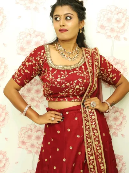 A still image of the maroon floral lehenga, focusing on the beautifully embroidered square-neck blouse.