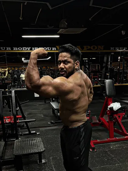 A back bicep pose.