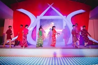 The entire group of young performers entering the stage. We help structure the performances with dramatic entries and exits to give every dance a professional and theatrical feel.