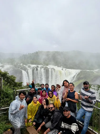 A large group of our trekkers posing with the magnificent Jog Falls in the background. Sharing this experience makes it even more special.