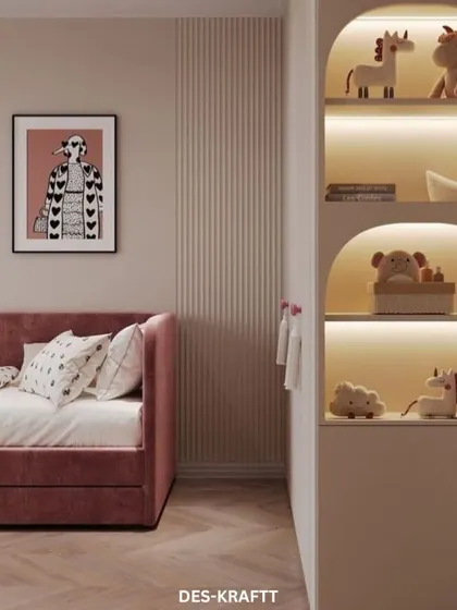 Built-in arched shelves with integrated lighting provide the perfect display for toys and books, turning storage into a beautiful design feature.