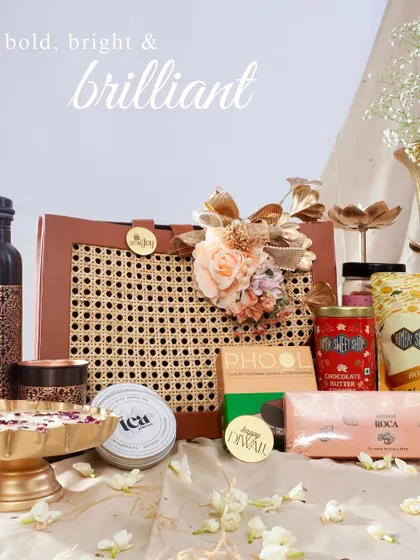 Here you can see our bold, bright, and brilliant hamper with all its contents revealed. It's packed with premium items like artisanal chocolates, gourmet snacks, and a stylish bottle, making it a complete festive package.