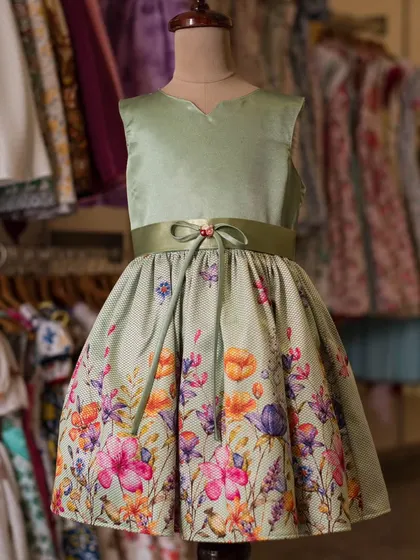 Another view of the elegant sage green floral dress, showcasing its unique color palette and flattering A-line silhouette.