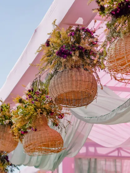 Another view of the hanging floral baskets, a key element of the 'Mint to Be' decor that adds a touch of rustic, garden-party charm.