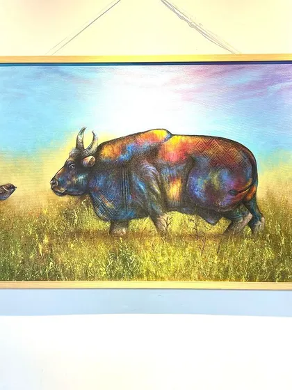 This colorful painting of an Indian Gaur is a beautiful example of abstract wildlife art. The artist uses a vibrant palette to highlight the animal's form, creating a piece that is both realistic and imaginative.