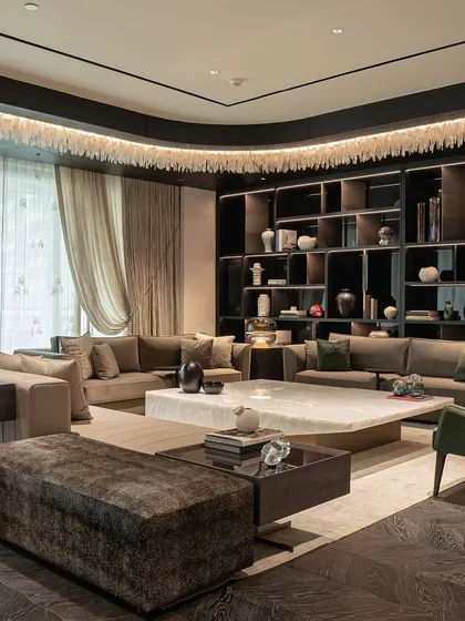 A testament to our client's vision, this living room at DLF Camellias features our custom furniture, including plush sofas and armchairs, arranged to create a luxurious and inviting atmosphere.