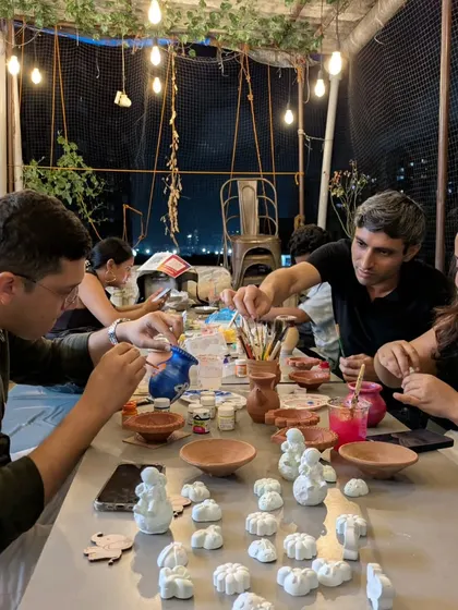 The fun continues after the wheel. Under the warm lights of our rooftop studio, you can sit together and paint your creations, adding personal touches and colors to your handmade pottery.