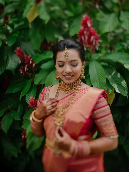 A classic bridal portrait showcasing the intricate details of the saree, jewelry, and makeup. We ensure every element of the bride's look is captured perfectly.