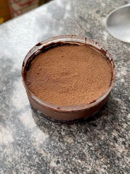 A close-up of the rich, multi-layered Dream Cake. It's an eggless dessert that packs a serious chocolate punch.