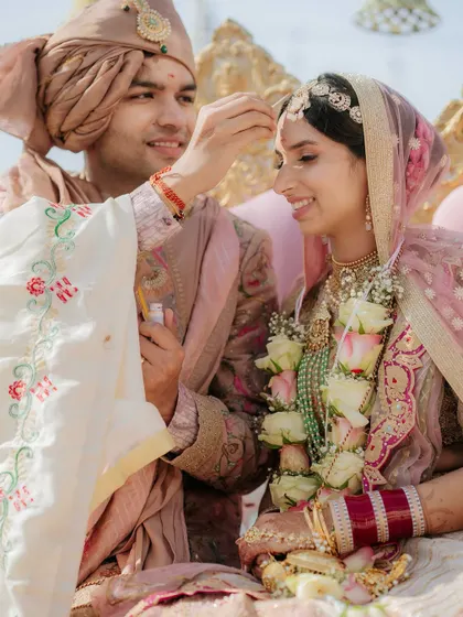 An intimate ritual during the wedding ceremony, where the groom applies sindoor. I focus on the gentle and meaningful details.