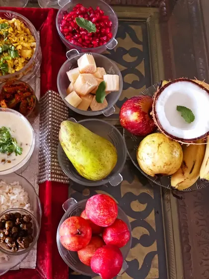 The offering of fresh fruits, coconut, and vegan doodh poha, representing the natural bounty of the earth.