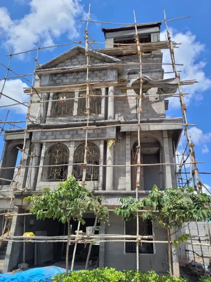 An ongoing neo-classical project under construction. This image shows the structural form taking shape, with the classical arches and columns already visible.