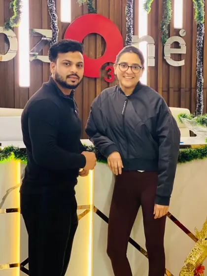 A trainer and member posing together, showcasing the friendly and community-oriented atmosphere of our club during the holidays.