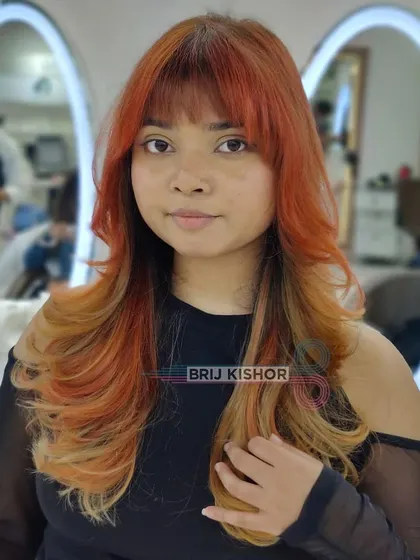 This Y2K hair color is all about having fun and expressing yourself. The bold orange and playful style scream 2000s.
