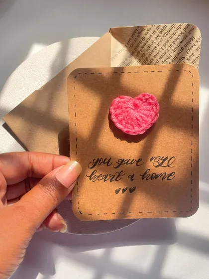 "You gave my heart a home." A cute card with a tiny crochet heart on rustic brown paper. The perfect little note for your favorite person.