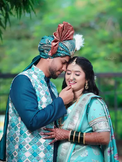 An intimate portrait where the groom gently touches the bride's chin. This simple gesture, captured up close, speaks volumes about their relationship and is a beautiful memory from their special day.