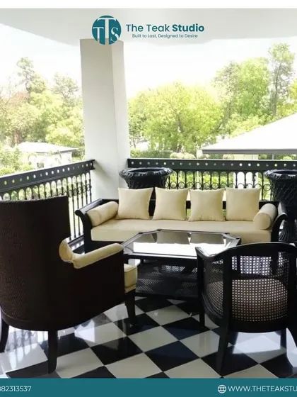 This elegant outdoor seating set is perfect for enjoying the weather on a balcony or patio. It includes a comfortable sofa and classic armchairs with caned details, all crafted to withstand the elements.