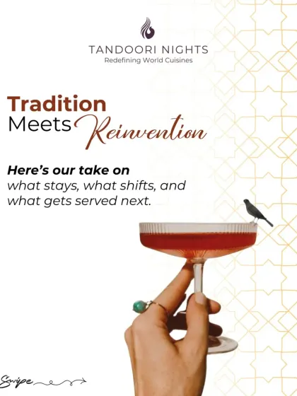 Tradition meets reinvention in a glass. A hand holds a classic coupe glass with a vibrant red cocktail, symbolizing our modern take on timeless recipes.