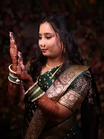 The bride admiring her engagement ring. Her makeup is subtle yet effective, ensuring she is the focus of every photograph.