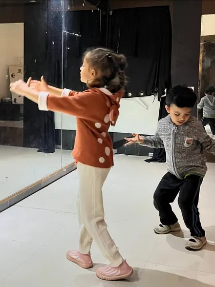 Young dancers learning choreography in my kids' class. These sessions focus on basic steps, rhythm, and expression, helping children develop their skills while having fun.