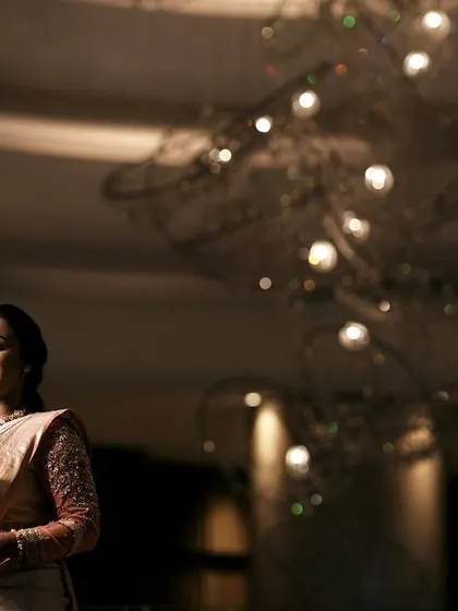 An artistic shot of the bride, with the focus on her elegant posture and the beautiful ambiance.