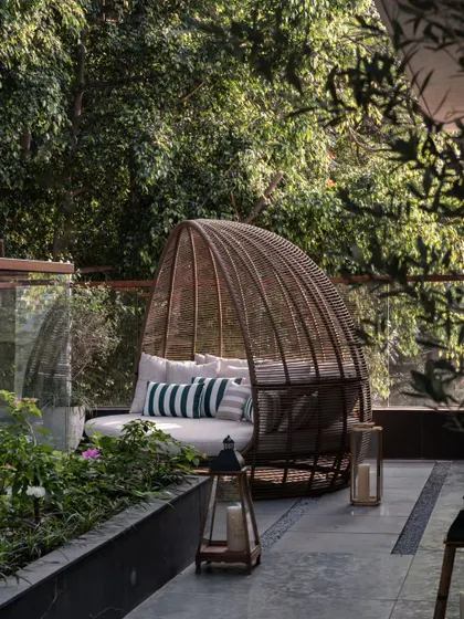 The full view of the terrace daybed, nestled among plants. We love creating these private outdoor nooks for quiet contemplation.