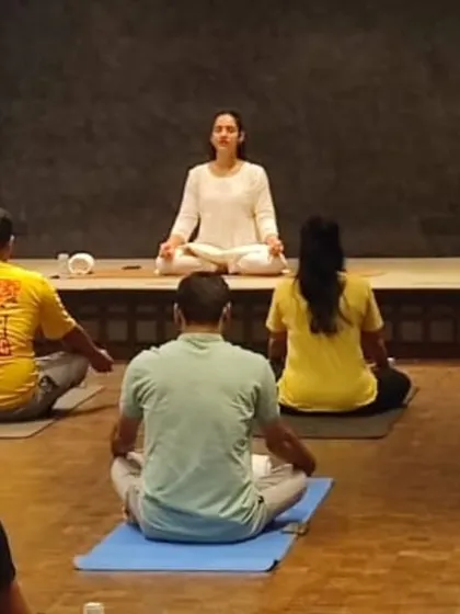 I guide a corporate group through a calming meditation session. My goal in these office wellness programs is to create a peaceful space for employees to disconnect from stress and reconnect with their inner calm, improving focus and well being.